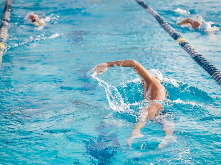 Man Swimming on an Indoor Swimming Pool
