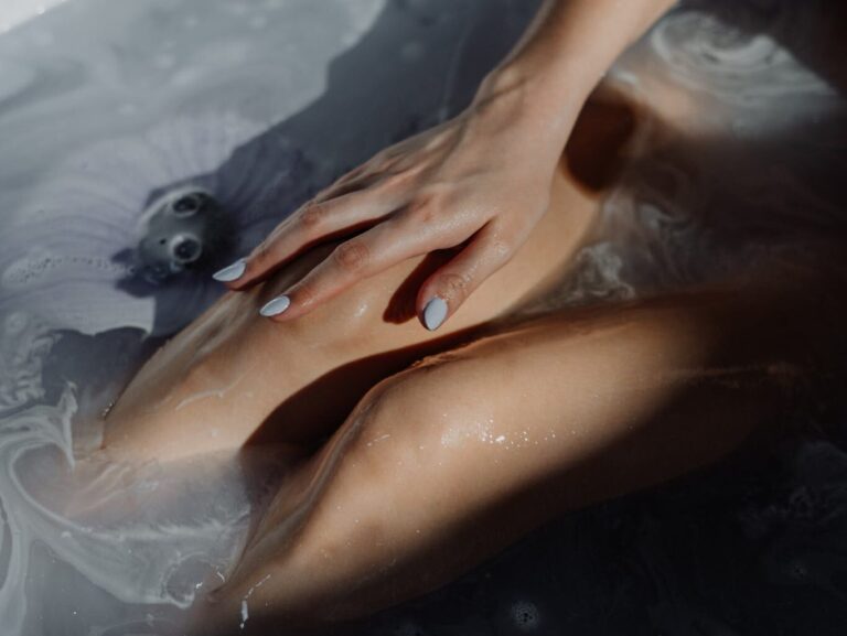 Woman in Water With Water Droplets