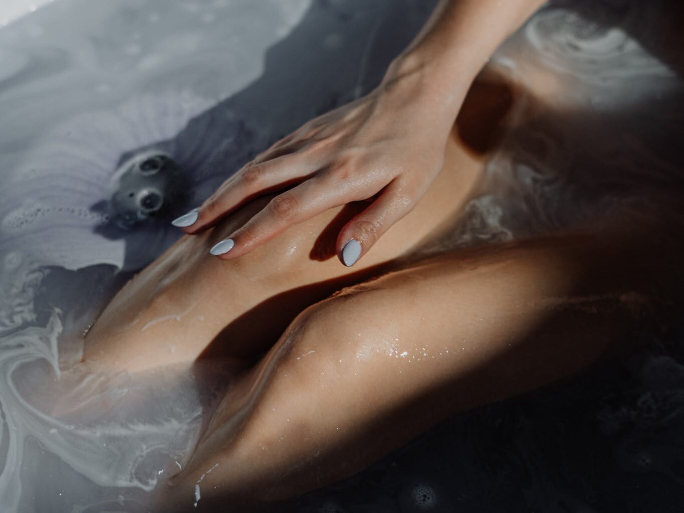 Woman in Water With Water Droplets